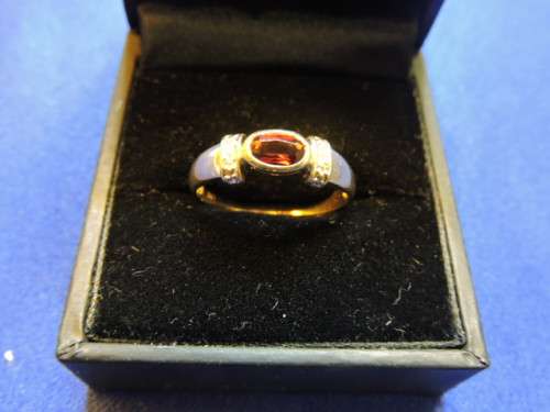 Solid 9ct Gold and diamond ring with red garnet as centre stone *crazy low price*